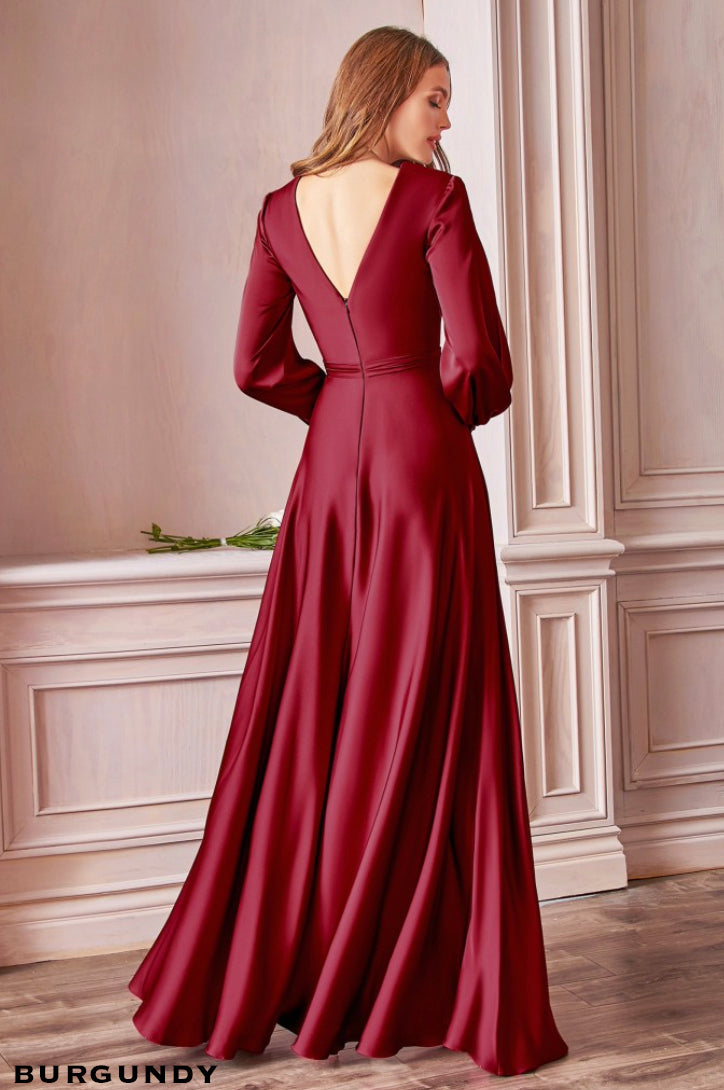 Back of light soft floor length satin bridesmaids gown with split blouson sleeves, wrap effect v-neck bodice and split skirt.