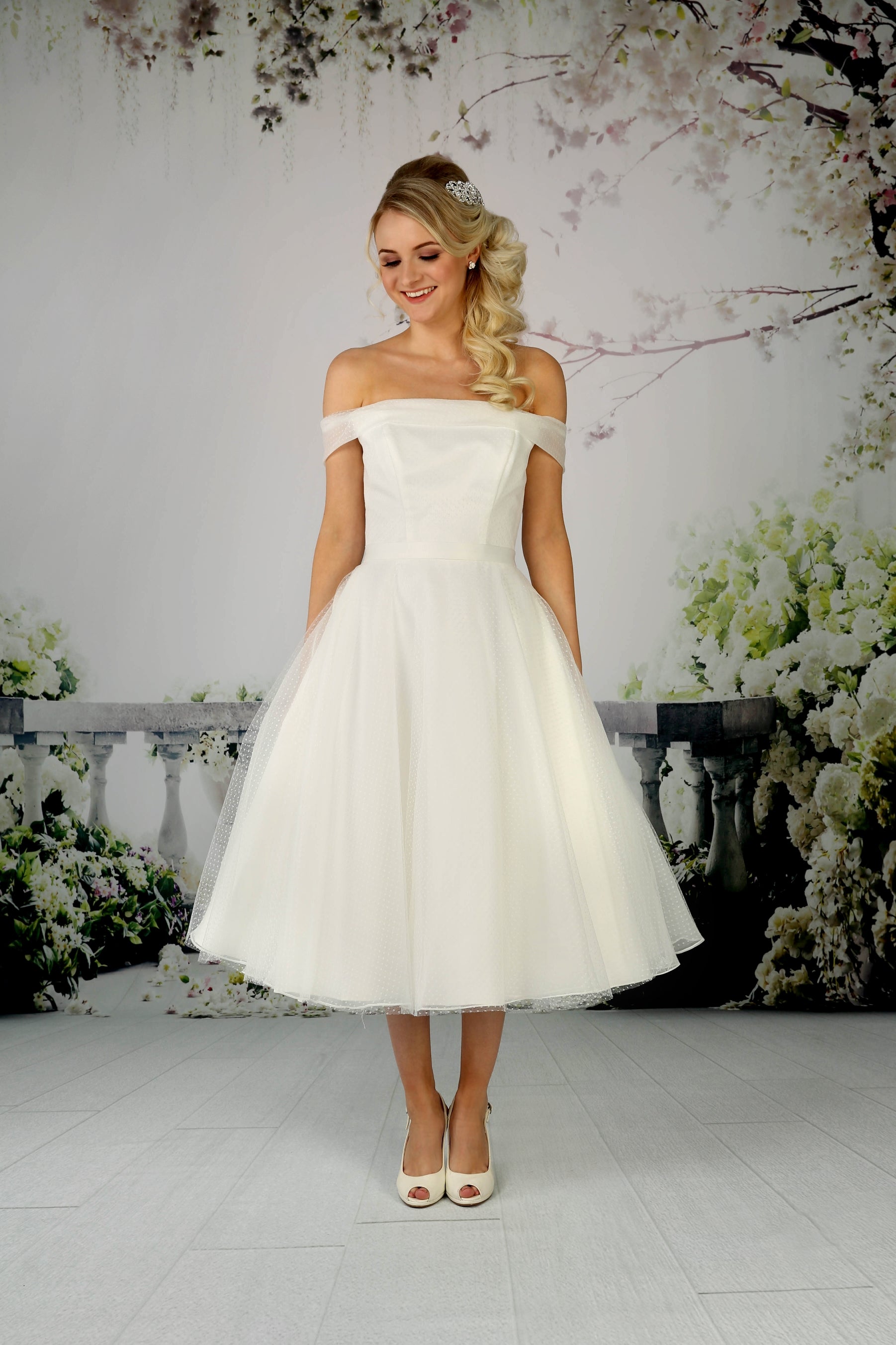 Pretty tea-length satin wedding dress with an organza and spot tulle overlay Pretty tea-length satin wedding dress with an organza and spot tulle overlay