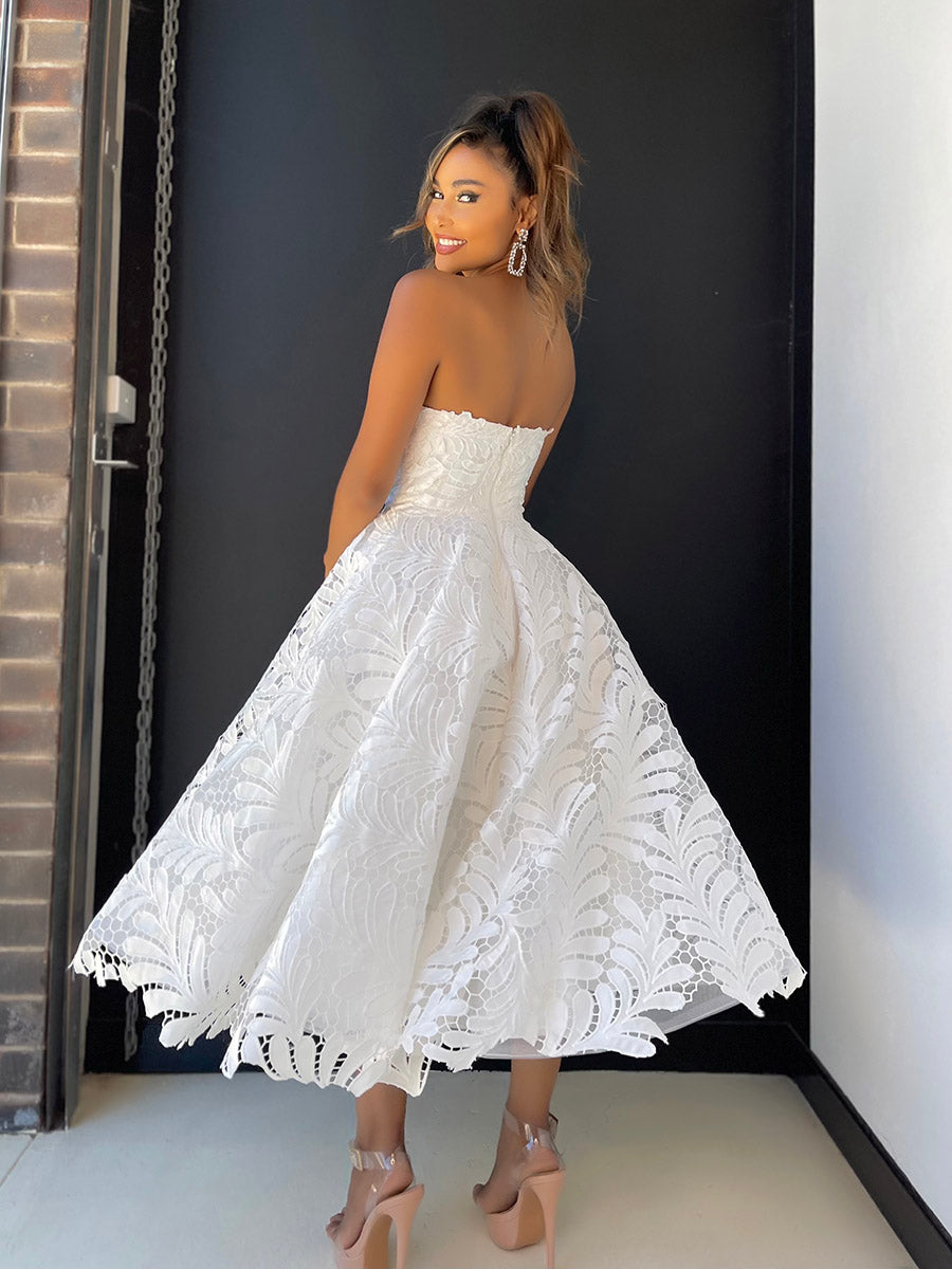 Back view of Ivory modern tea length wedding dress in fashionable leaf lace