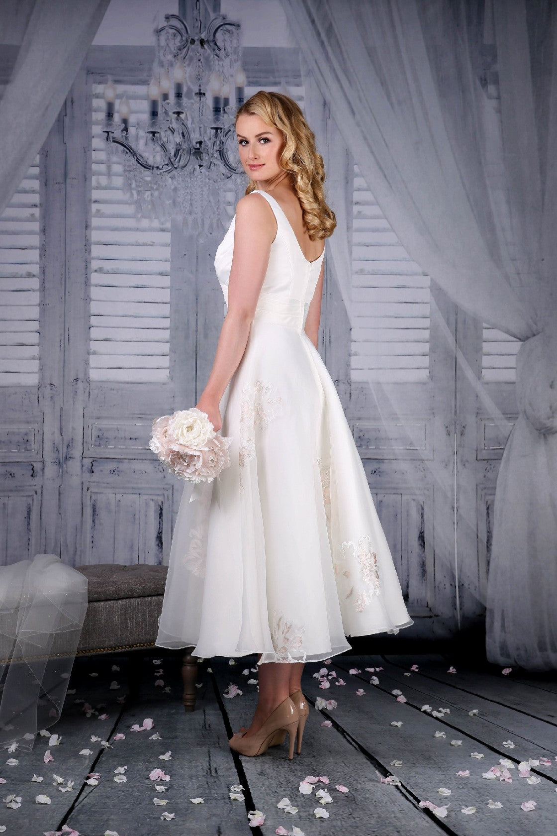Back of the ivory Jenny tea length wedding dress