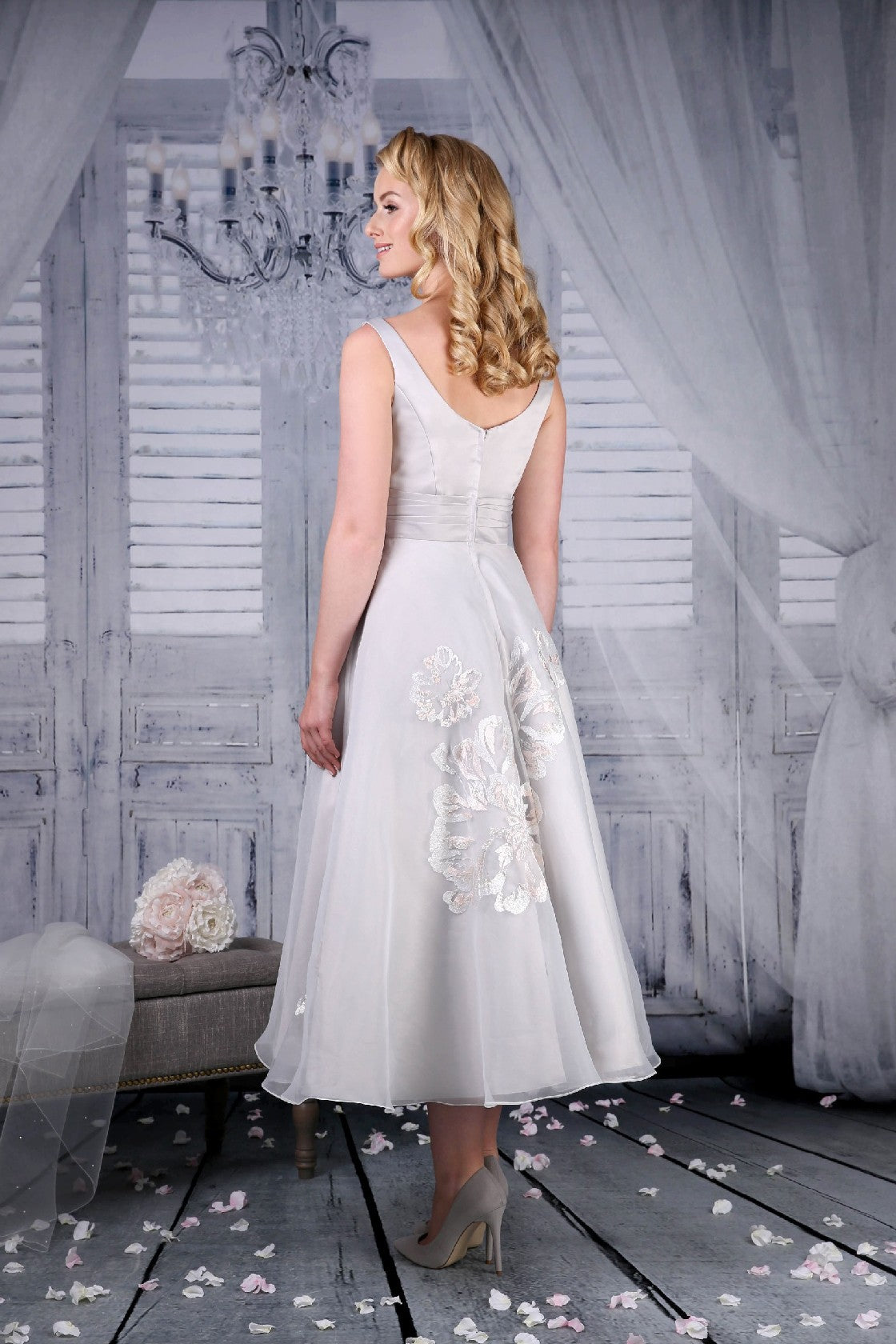 The back of the Jenny tea length wedding dress in platinum