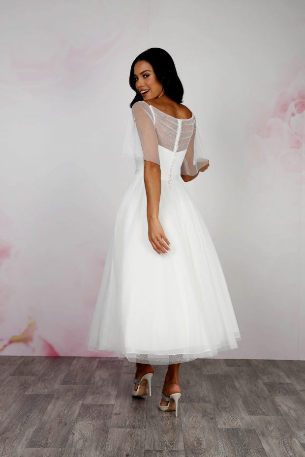 Back of dotty tulle tea length wedding gown with soft flutter sleeves, cinched in waist and full twirly 50's style full skirt | rd-stephanie