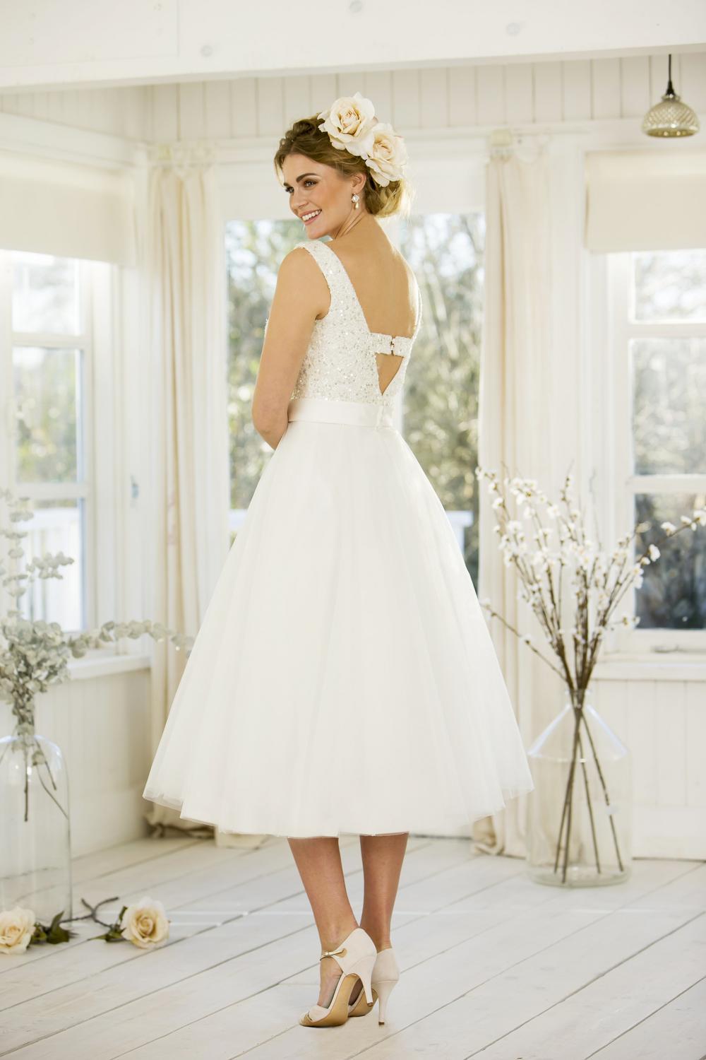 tb-jennifer Tea length bridal gown with flared skirt, stunning sequined bodice and satin sash to waist.