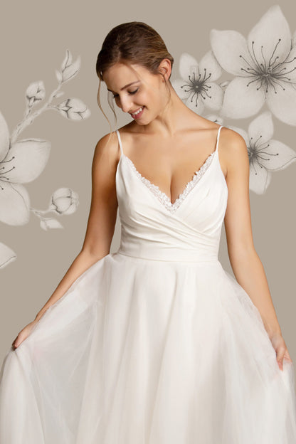 Close up of the bodice of the Moira chiffon and sequin tulle wedding dress