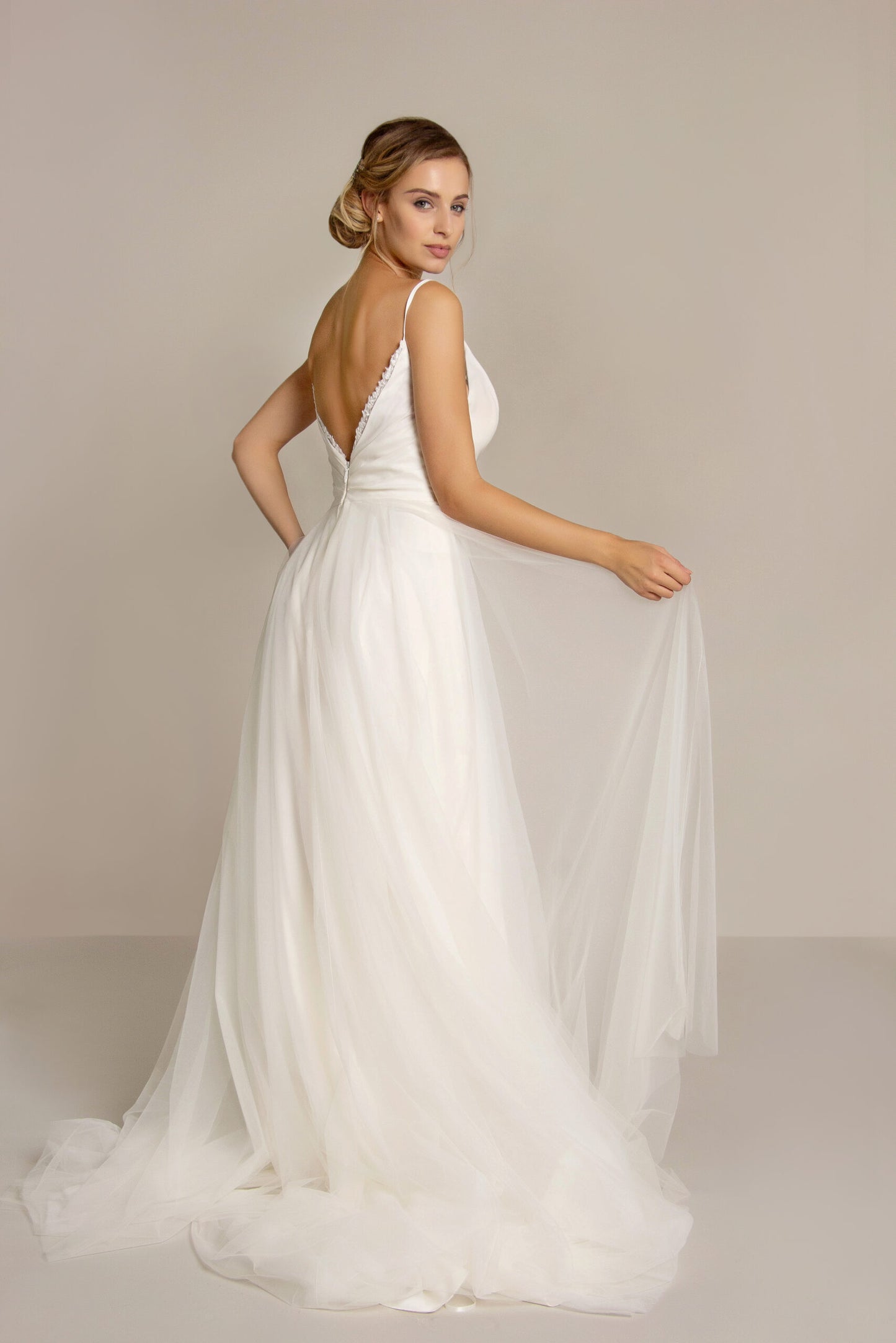 Side view of the Moira chiffon and sequin tulle wedding dress