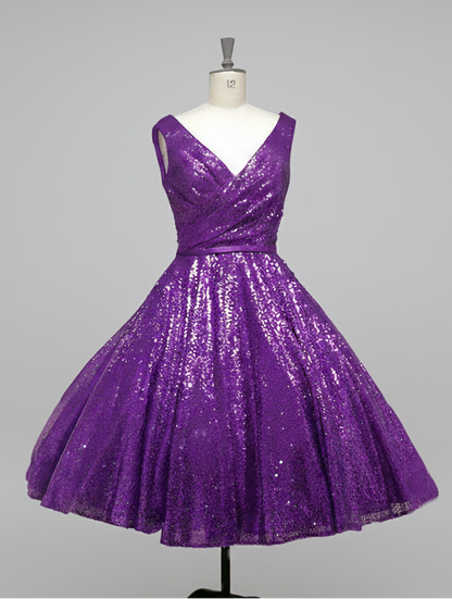 ab-nicole-r  Fifties length sequin gown with full skirt and cross over bodice.