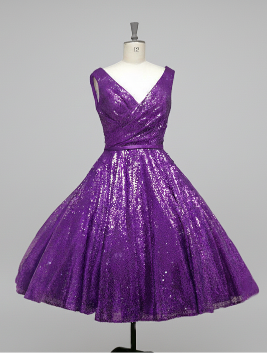 ab-nicole-r  Fifties length sequin gown with full skirt and cross over bodice.