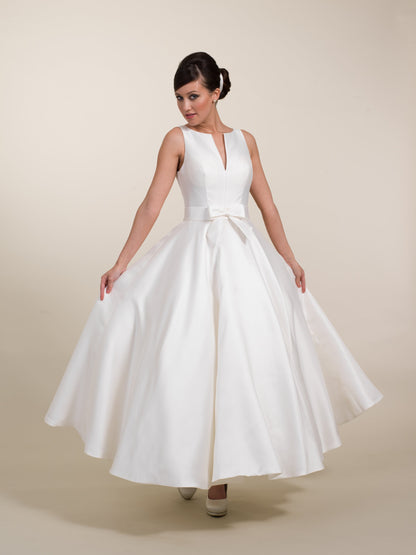 The full skirt of the Veronica tea length wedding ress