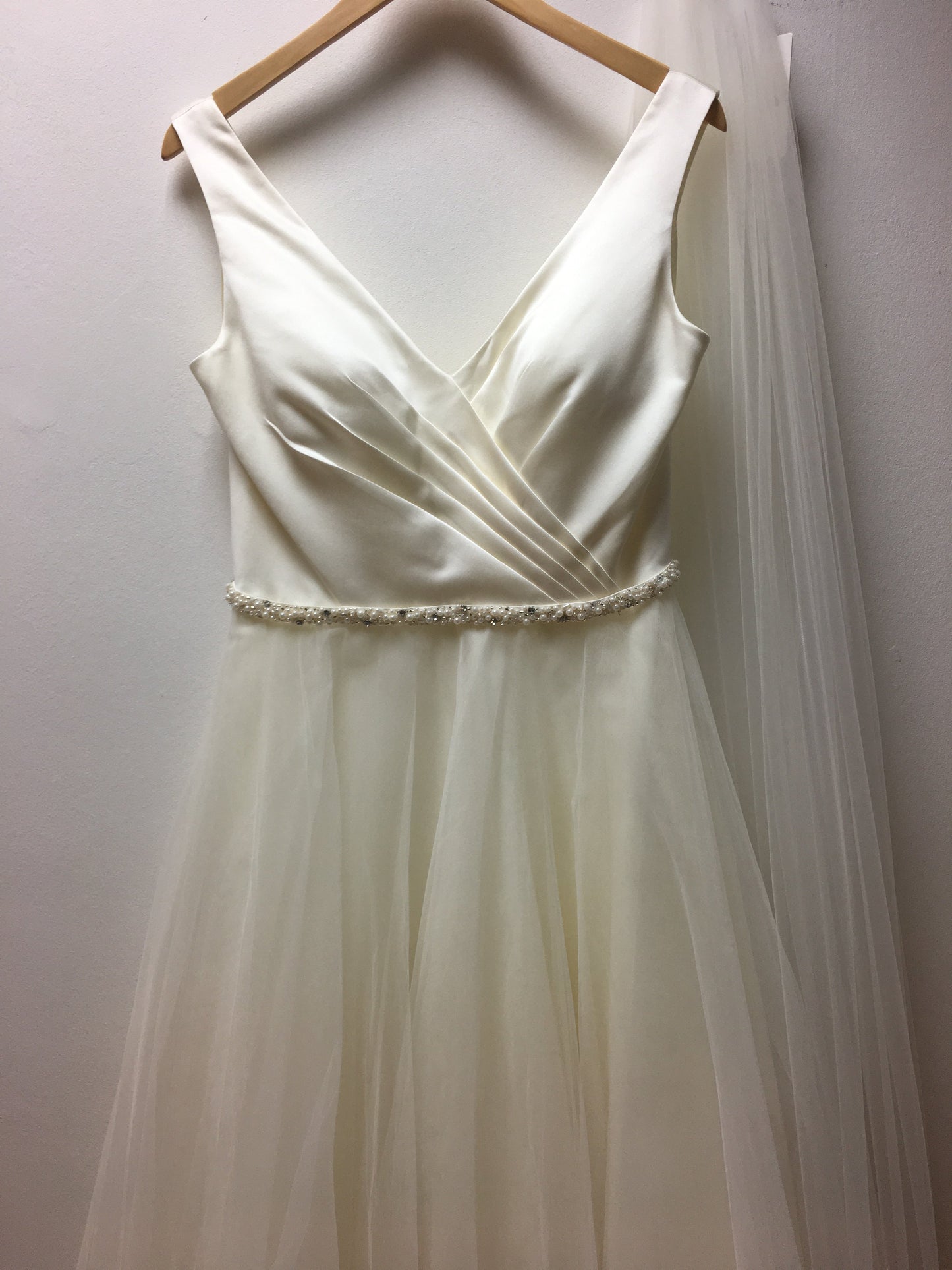 tb-ria Tea length wedding dress with plunge neck and full tulle skirt.