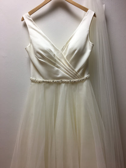 tb-ria Tea length wedding dress with plunge neck and full tulle skirt.