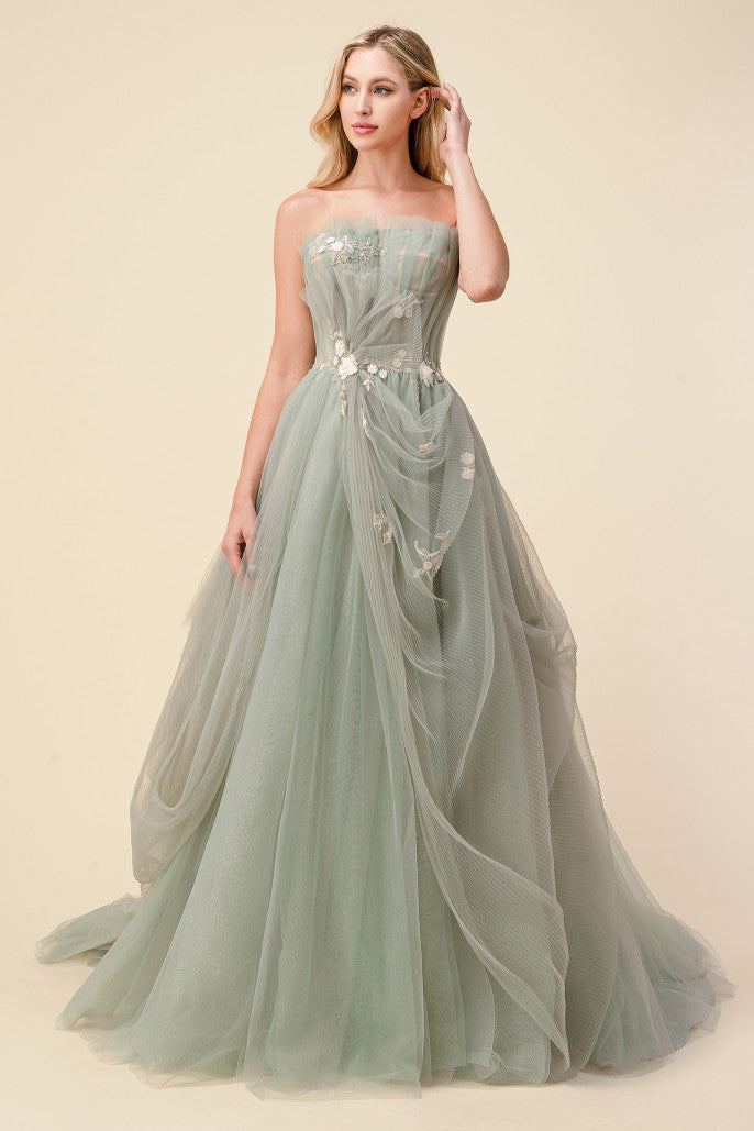 The Eloise is a sage alternative wedding or ball gown with delicate blossom details is made of beautifully draped plisse tulle that pleats over a nude corset bodice al-eloise