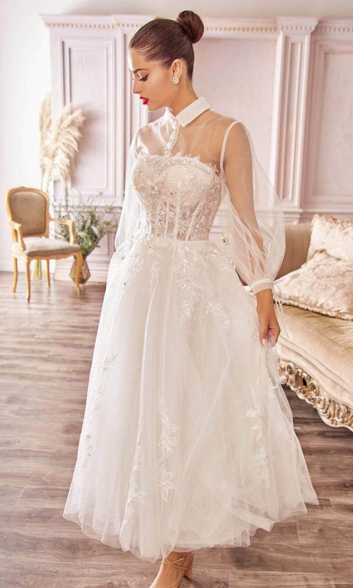 The Lucinda is a long sleeve, high colour, tea length wedding gown with modern sheer boned bodice and full tulle tea length skirt al-lucinda