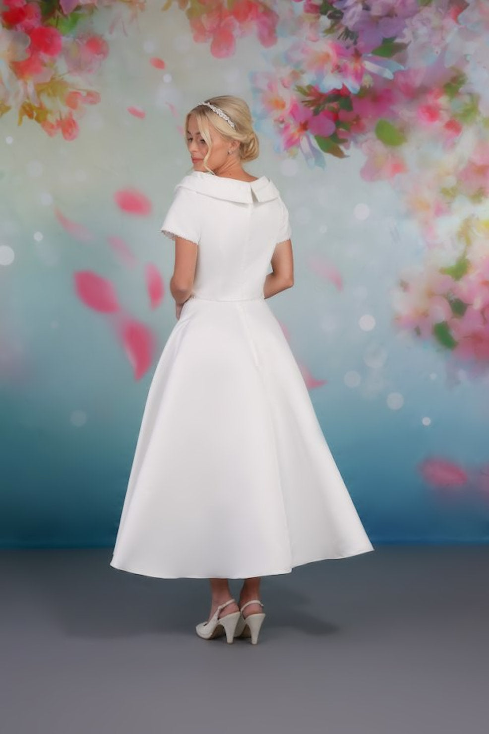 Back of classic design satin tea-length gown with soft A-line skirt and shawl collar rd-nora