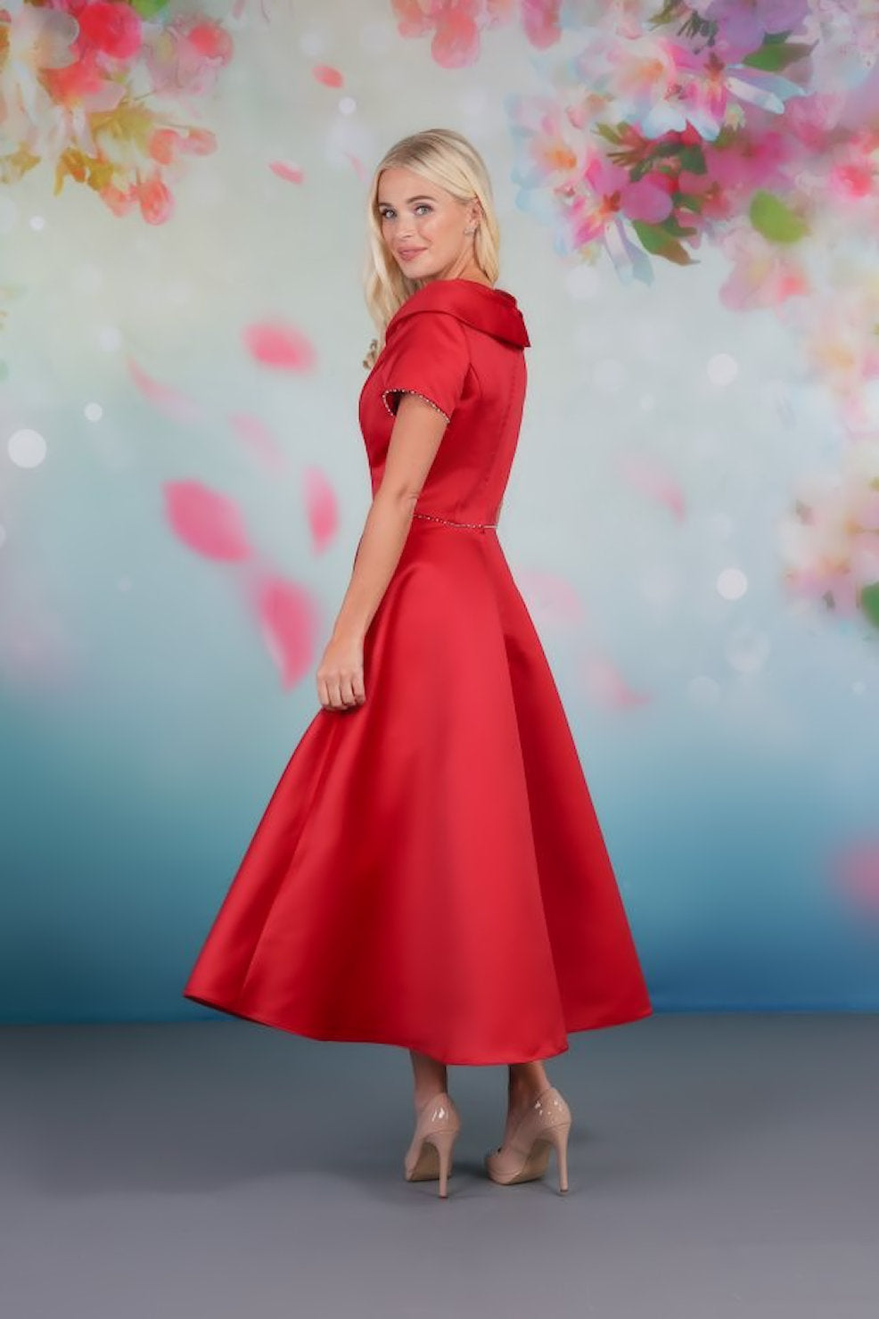 Side view of classic design satin tea-length gown with soft A-line skirt and shawl collar
