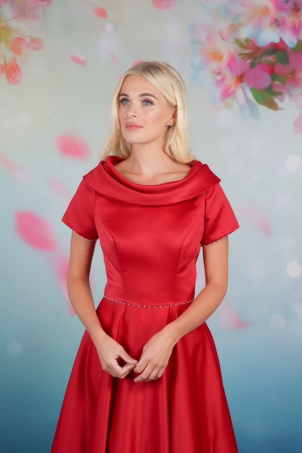 Close up of the classic design satin tea-length gown with soft A-line skirt and shawl collar