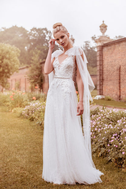  Soft tulle is layered over sparkle Chantilly lace wedding gown