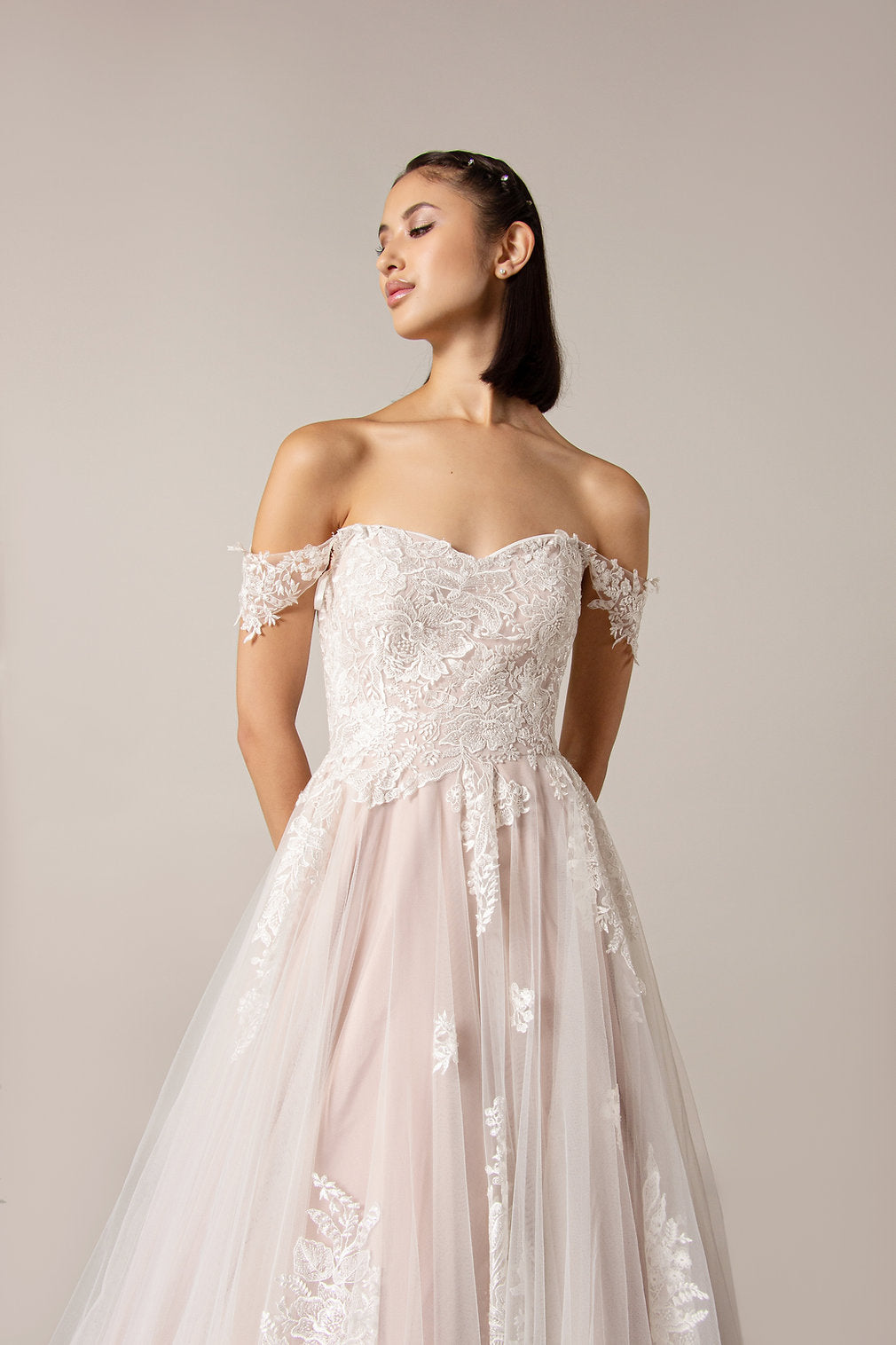 Closeup of the Joni off-the-shoulder Boho ball gown with luxury lace bodice,  drop shoulder straps and zip back.