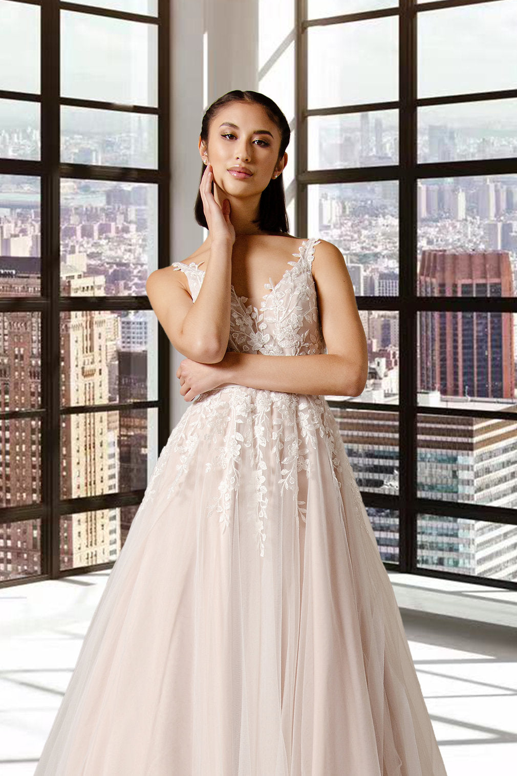The Lyra tulle and lace, V neckline soft silhouette Boho bridal or ball gown with pretty lace over bodice that trails into the skirt.
