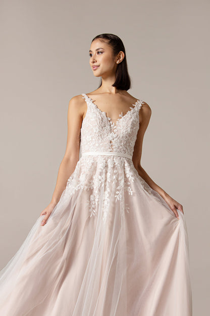 Closeup of the Lyra tulle and lace, V neckline soft silhouette Boho bridal or ball gown with pretty lace over bodice that trails into the skirt.