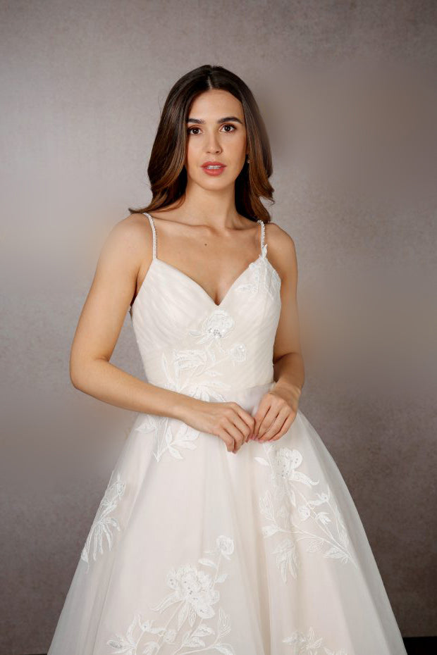 Closeup of pleated tulle tea length wedding dress with thin bodice straps | rd-iris
