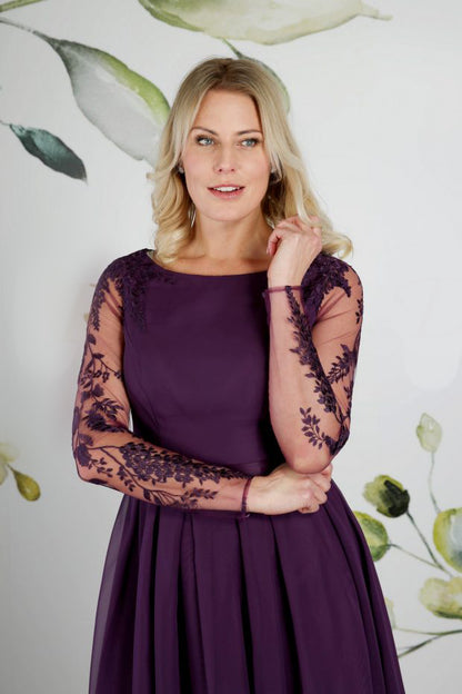 The bodice of tea length wedding dress in amethyst with high low hem and a fully pleated chiffon skirt | rd-linton