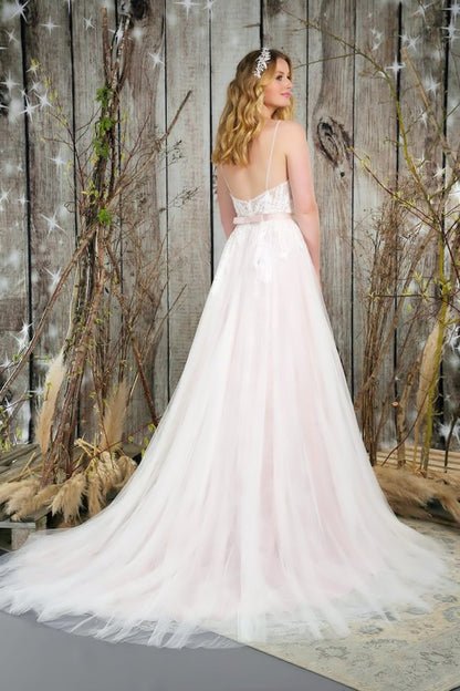 Back and train of soft, flowing bridal gown with the most beautiful textures of lace and tulle