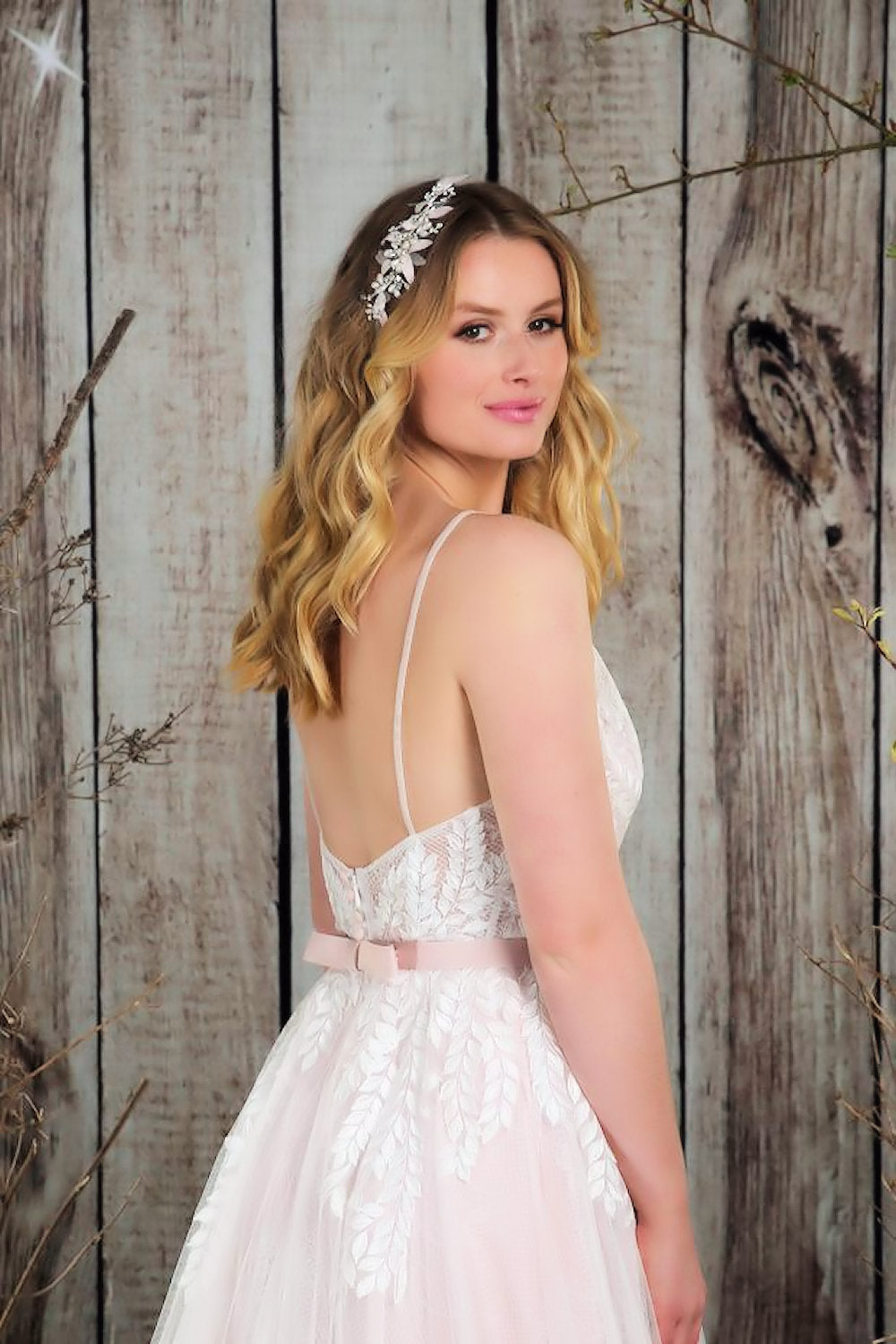 Close up of  soft, flowing bridal gown with the most beautiful textures of lace and tulle