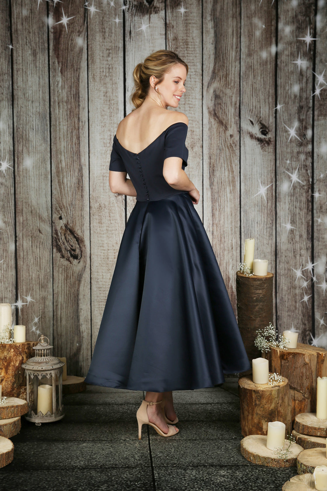 The back of the Rosemary tea length satin wedding dress in navy